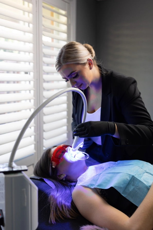 Applying teeth whitening treatment